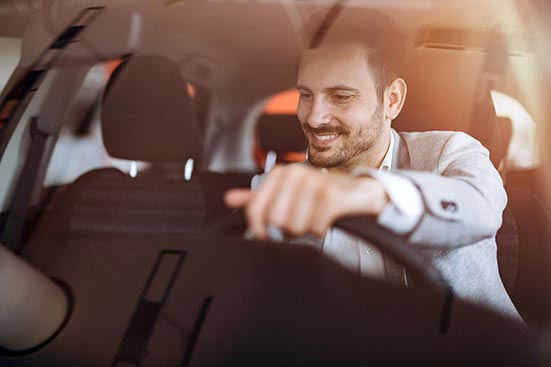 Young man in new car