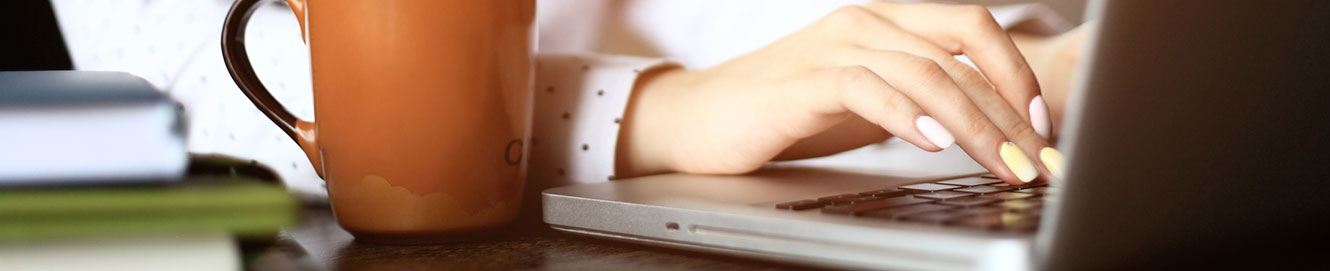 Woman typing on computer